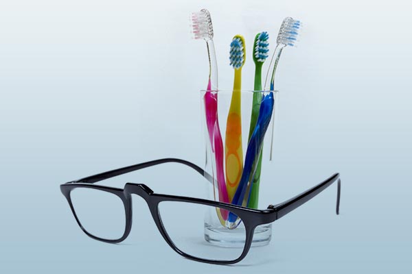 Image of glasses and toothbrushes